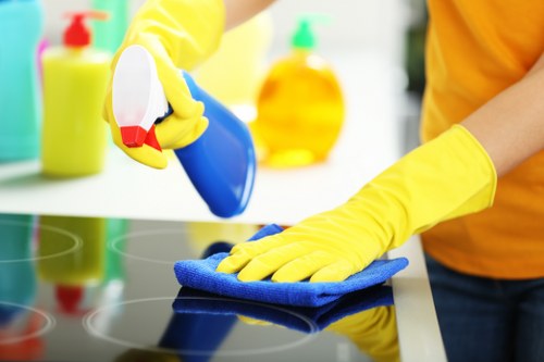 Deep cleaning a kitchen during an Acton move-out service